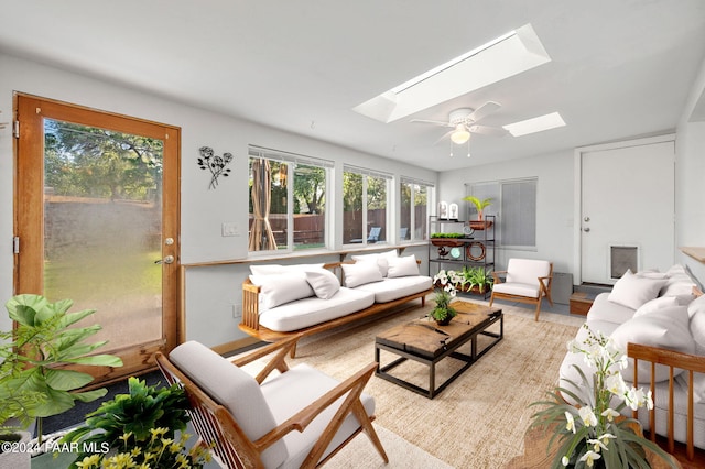 sunroom / solarium featuring a skylight and ceiling fan