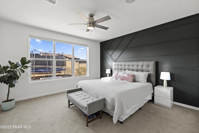 bedroom featuring carpet flooring, a ceiling fan, and baseboards