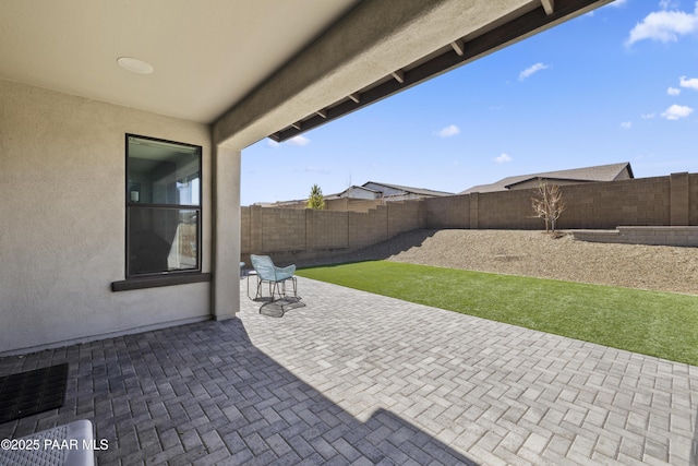 view of patio with a fenced backyard