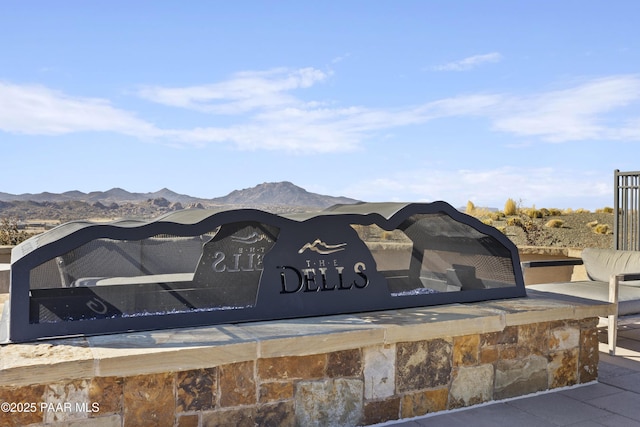 community sign featuring a mountain view