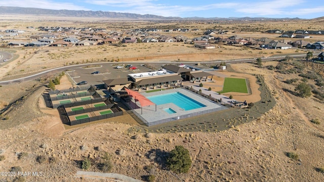 birds eye view of property with a mountain view