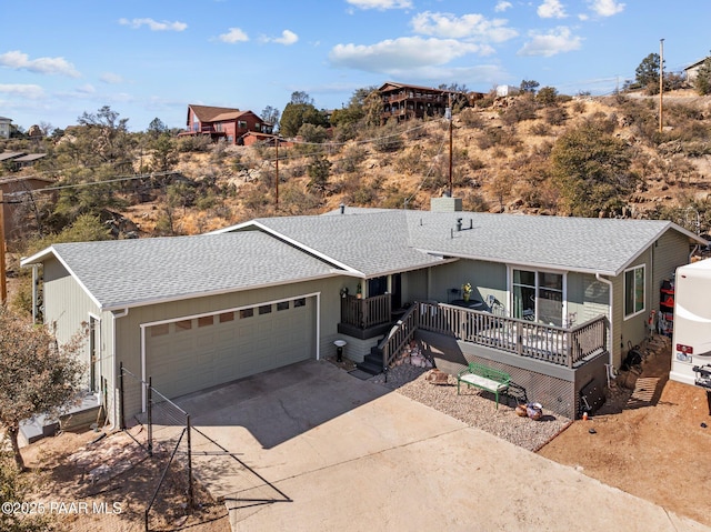 single story home with a porch and a garage