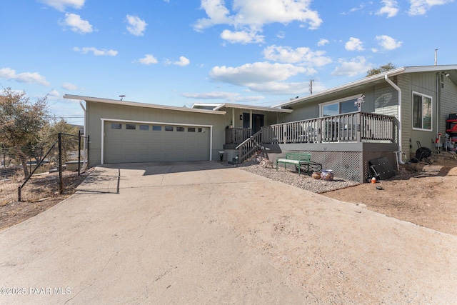 view of front of home featuring a porch and a garage