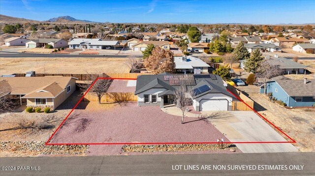 birds eye view of property with a mountain view