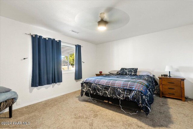 carpeted bedroom with ceiling fan