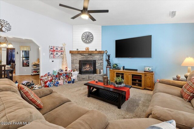 carpeted living room featuring ceiling fan and vaulted ceiling