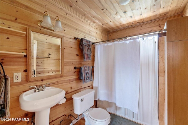 bathroom featuring toilet, wood ceiling, and wood walls