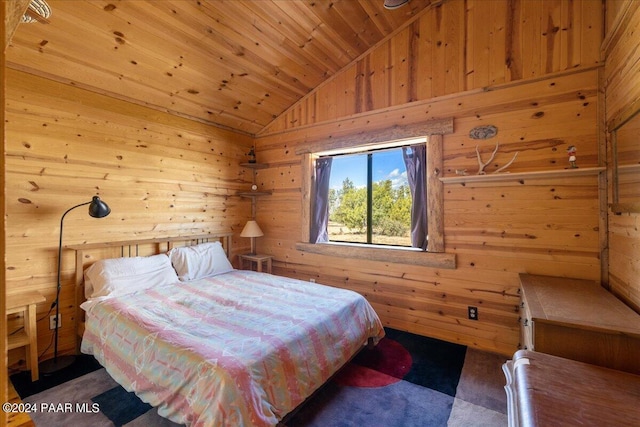 carpeted bedroom featuring vaulted ceiling, wood ceiling, and wood walls