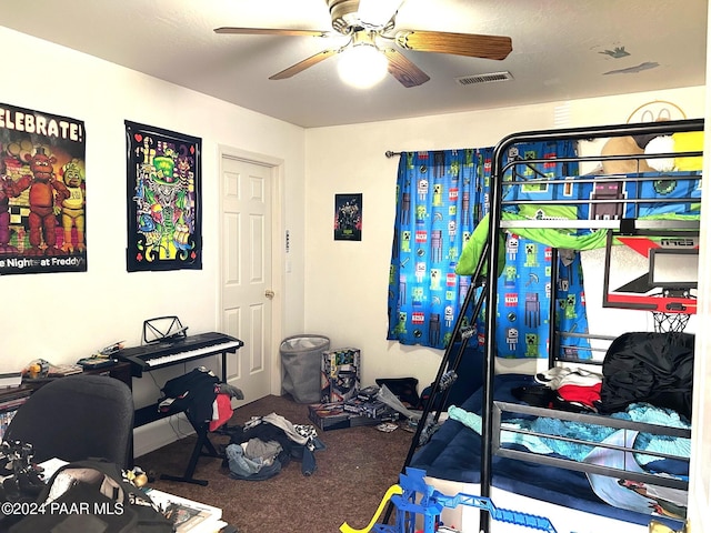 bedroom featuring ceiling fan and carpet flooring