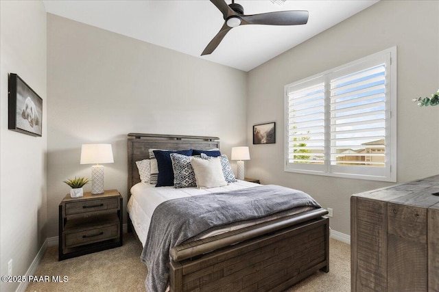 bedroom featuring baseboards, ceiling fan, and carpet flooring