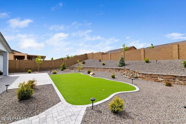 view of yard featuring a fenced backyard and a patio