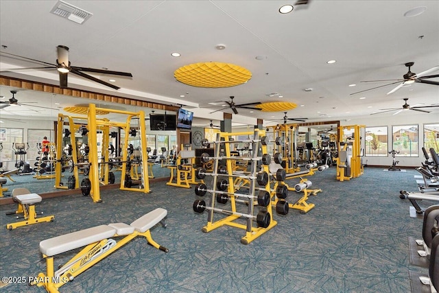 exercise room featuring carpet flooring, recessed lighting, ceiling fan, and visible vents