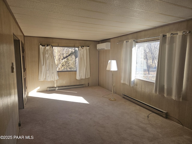 carpeted empty room with a baseboard radiator, a wall mounted air conditioner, and wooden walls