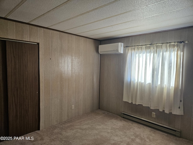 carpeted empty room with a baseboard heating unit, a wall mounted air conditioner, and wooden walls