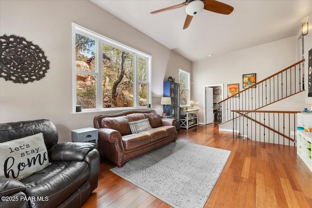 living room featuring hardwood / wood-style flooring and ceiling fan