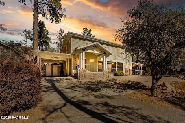 craftsman house featuring a carport and covered porch