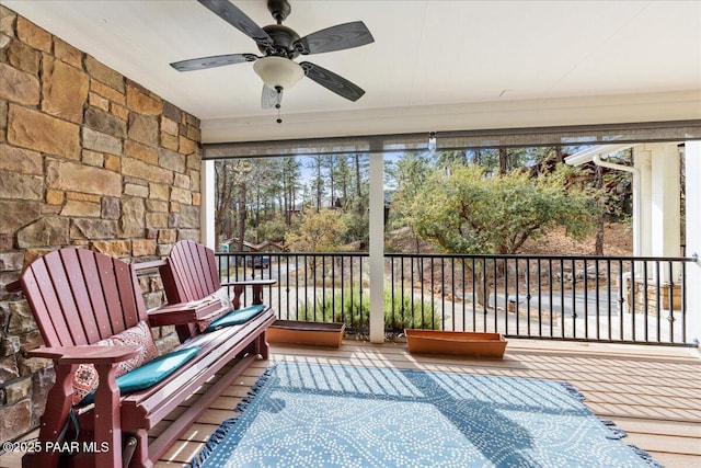 sunroom with ceiling fan