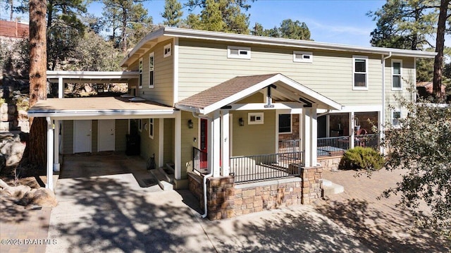 front facade featuring a carport and covered porch