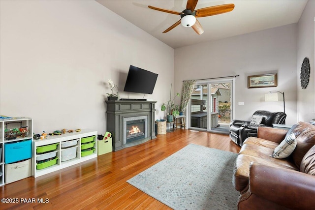 living room featuring hardwood / wood-style flooring and ceiling fan