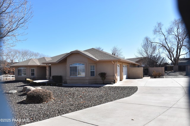 920 Heather Ln, Chino Valley, AZ 86323 - ranch-style home with concrete driveway, an attached garage, and stucco siding