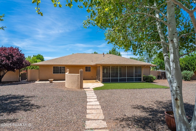 920 Heather Ln, Chino Valley, AZ 86323 - rear view of house with stucco siding, a patio, a sunroom, and roof with shingles