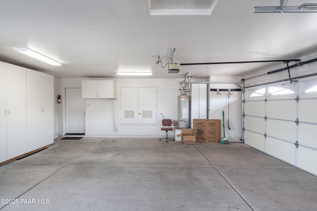 920 Heather Ln, Chino Valley, AZ 86323 - garage featuring gas water heater and a garage door opener