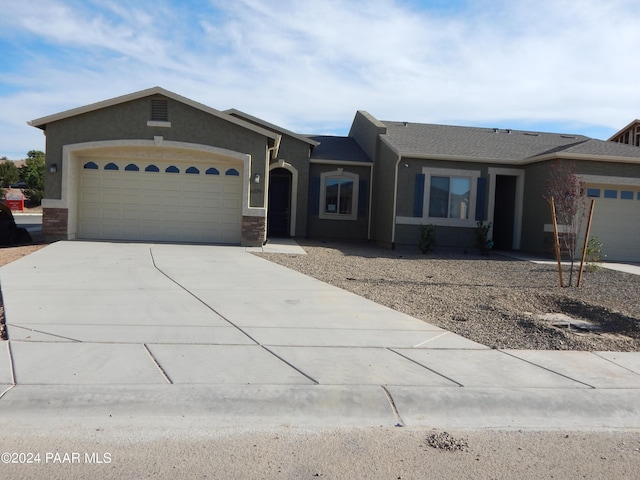 ranch-style house featuring a garage