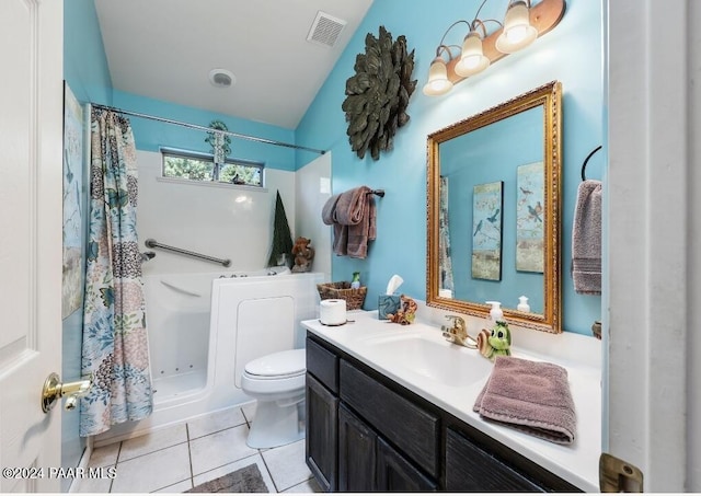 bathroom featuring tile patterned floors, vanity, and toilet