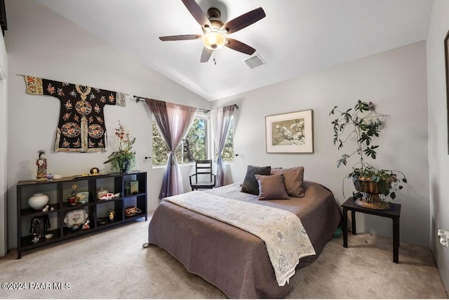 carpeted bedroom with ceiling fan and lofted ceiling