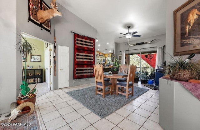 tiled dining room featuring ceiling fan