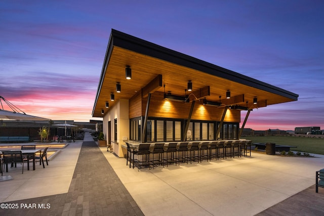 patio terrace at dusk with exterior bar