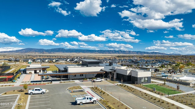 birds eye view of property featuring a mountain view