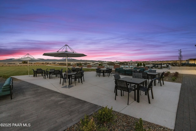 view of patio terrace at dusk