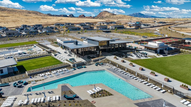 birds eye view of property featuring a mountain view