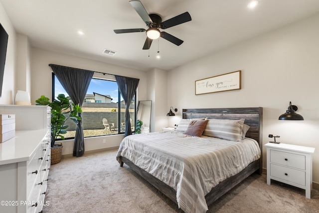 bedroom with light colored carpet and ceiling fan