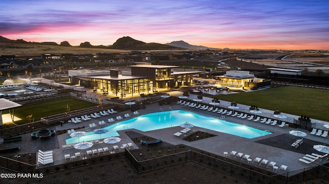 pool at dusk with a mountain view