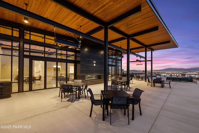 view of patio terrace at dusk