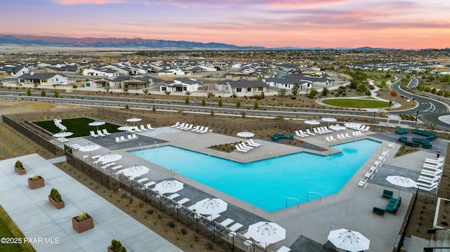 pool at dusk with a mountain view