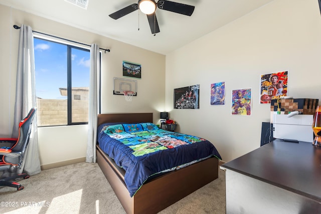 bedroom with ceiling fan and light colored carpet