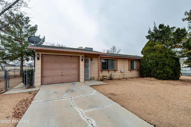 ranch-style home featuring a garage