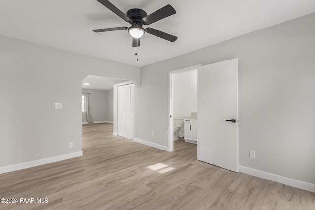 unfurnished room featuring ceiling fan and light wood-type flooring