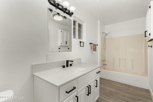 full bathroom with toilet, shower / washtub combination, vanity, and hardwood / wood-style flooring