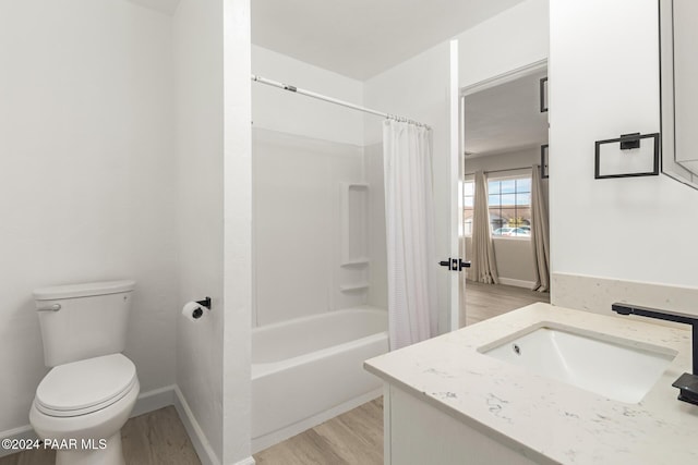 full bathroom featuring shower / bathtub combination with curtain, vanity, wood-type flooring, and toilet