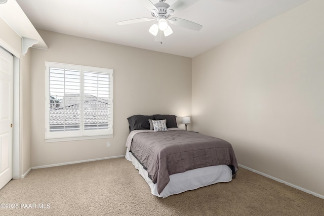 bedroom with baseboards, a ceiling fan, and carpet flooring