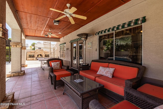 view of patio with ceiling fan and an outdoor hangout area