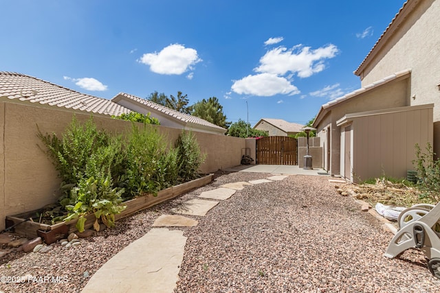 view of yard with a gate and fence