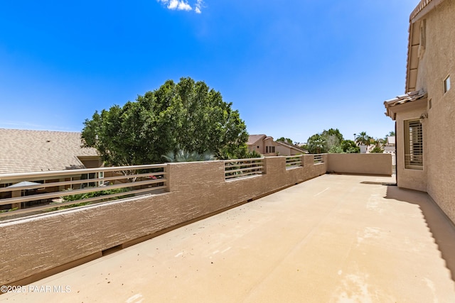 view of patio featuring a balcony