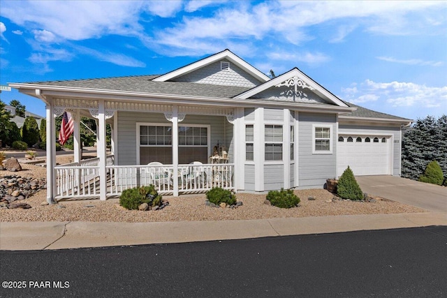 view of front of home featuring a garage and a porch