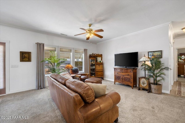 living room with ceiling fan, light colored carpet, and crown molding