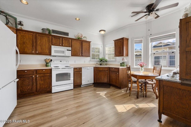 kitchen with light hardwood / wood-style floors, white appliances, ornamental molding, and ceiling fan